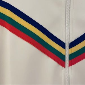 White track jacket with rainbow stripes